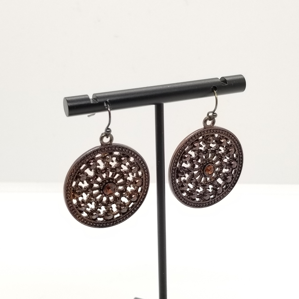 dark coppery cutout disk earrings with orange rhinestone